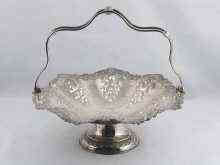 Appraisal: A silver swing handle basket with embossed decoration hallmarked for