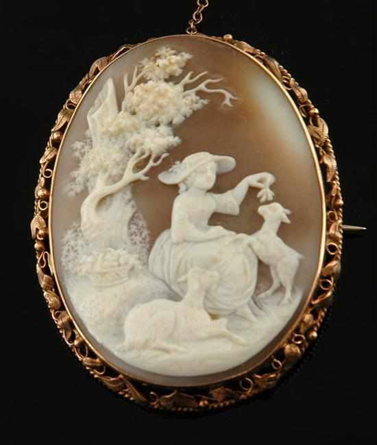 Appraisal: A Victorian cameo brooch The shell cameo depicting a pastoral