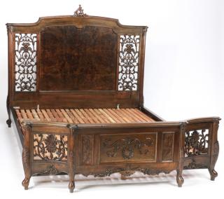 Appraisal: Carved Chinese Rococo inspired bed Chinese carved hardwood highback low