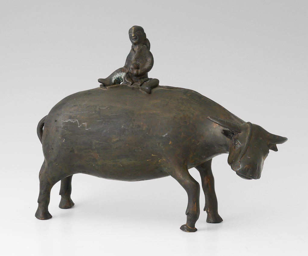 Appraisal: ORIENTAL BRONZE WATER BUFFALO SCULPTURE With Small Young Child Sitting