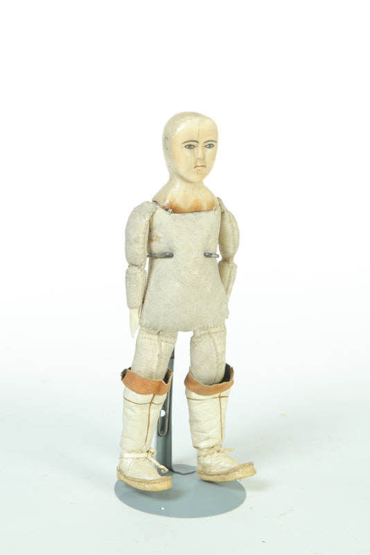 Appraisal: DOLL Eskimo early th century walrus ivory and leather Charming