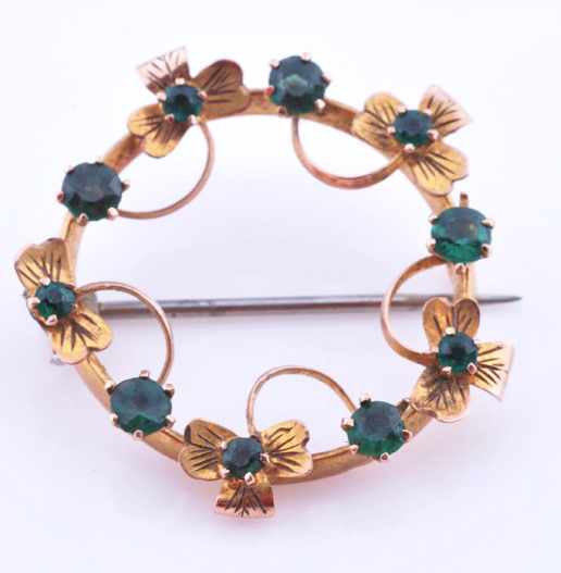 Appraisal: A GREEN STONE SET BROOCH TESTED CT GOLD