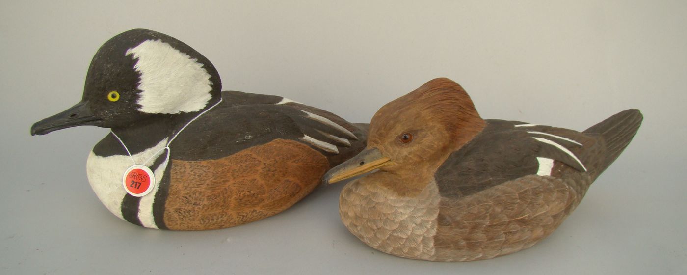 Appraisal: PAIR OF LIFE-SIZE HOODED MERGANSER DECOYS Decoratively carved by Lewis