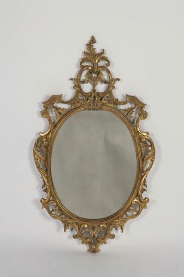 Appraisal: A GEORGE III STYLE CHIPPENDALE WALL MIRROR with an oval