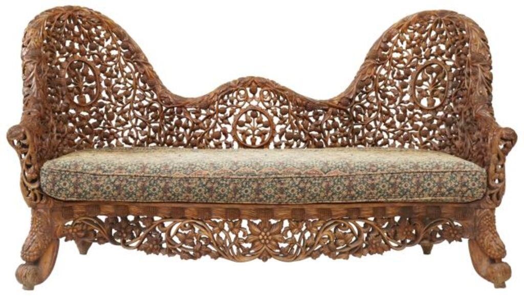 Appraisal: Burmese heavily carved settee th c reticulated foliate and floral