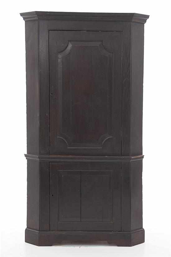 Appraisal: Georgian oak corner cupboard early th century molded cornice over