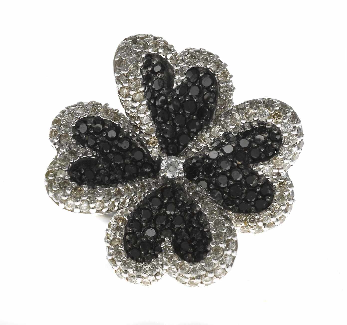 Appraisal: A diamond and black diamond flower ring estimated total diamond