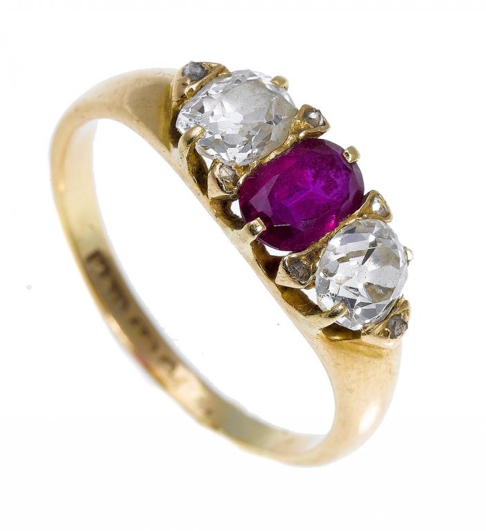 Appraisal: A RUBY AND DIAMOND THREE-STONE RING the oval ruby flanked