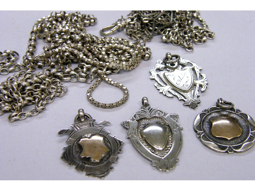 Appraisal: Five silver necklets three silver alberts and four silver medallion