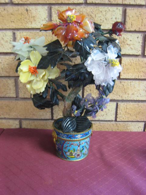 Appraisal: A carved and moulded glass Flower in cloisonne Pot in