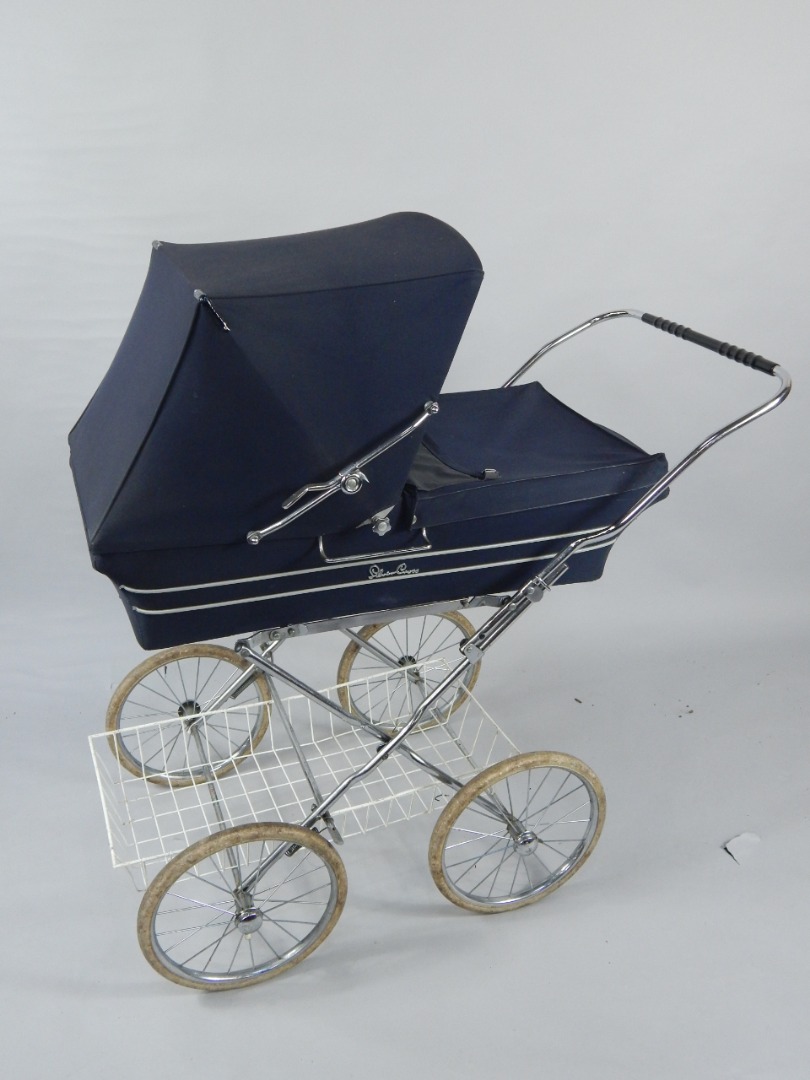 Appraisal: A Silver Cross pram with a sprung chassis blue fabric