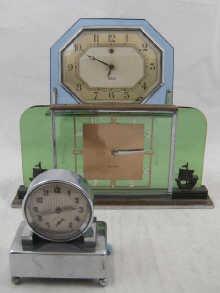 Appraisal: An Art Deco day green glass and chrome mantle clock