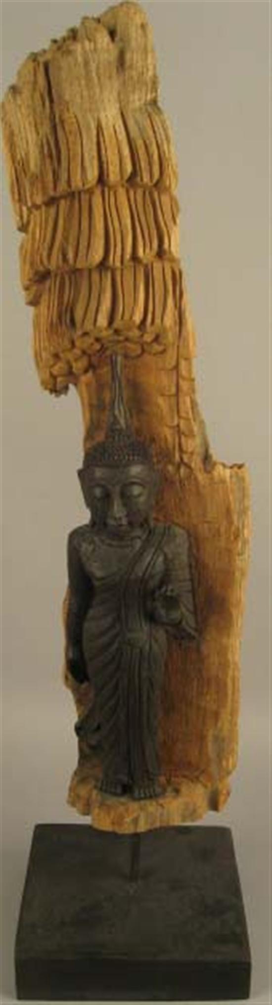 Appraisal: Buddha Figure in dark wood carved from tree Mounted on