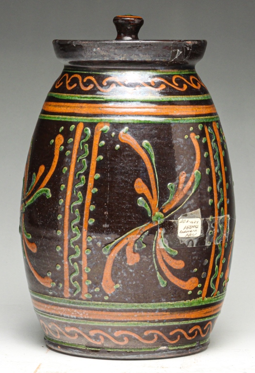 Appraisal: GREG SCHOONER OHIO LIDDED REDWARE JAR Late th century Brown