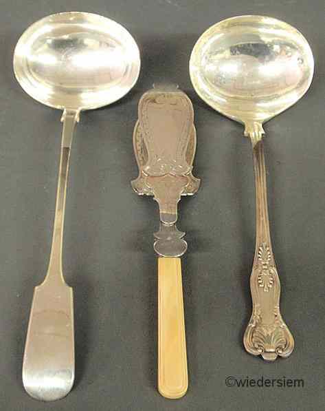 Appraisal: English Victorian silver tart server ''l and two silverplate ladles