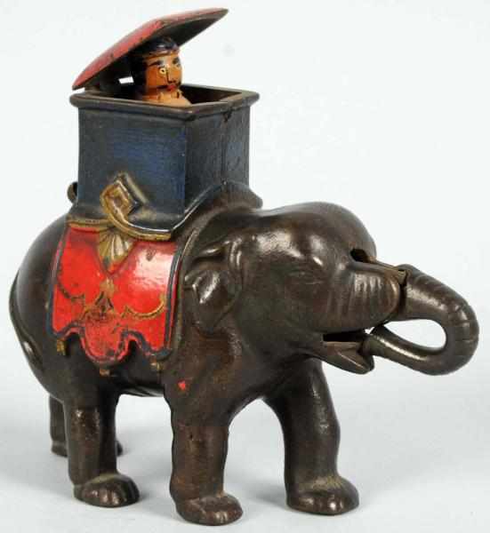 Appraisal: Cast Iron Elephant Howdah Mechanical Bank Man pops out variation