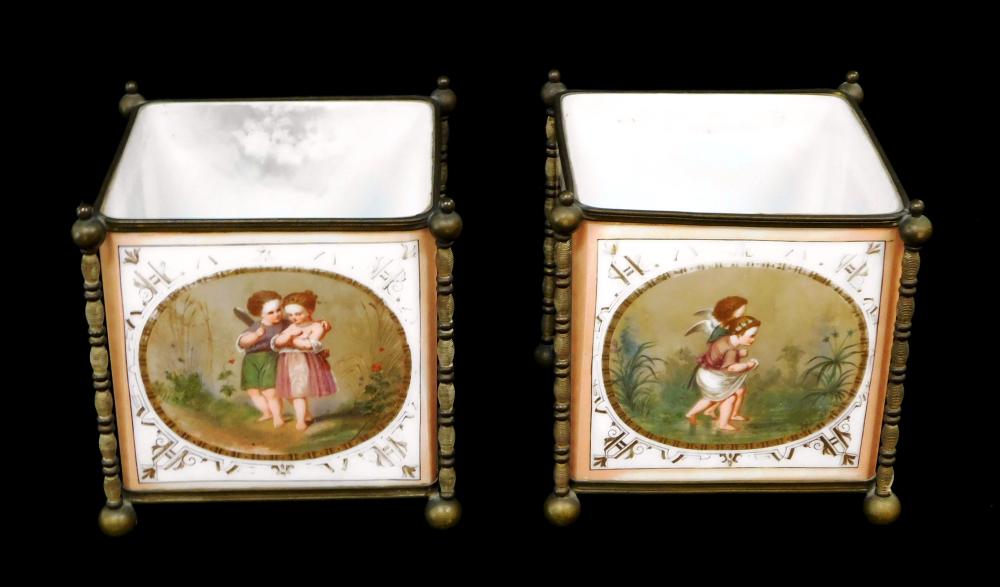 Appraisal: Two large candle votives both with figural decoration on square