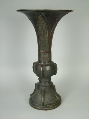 Appraisal: A Chinese bronze gu vase in the Han style the