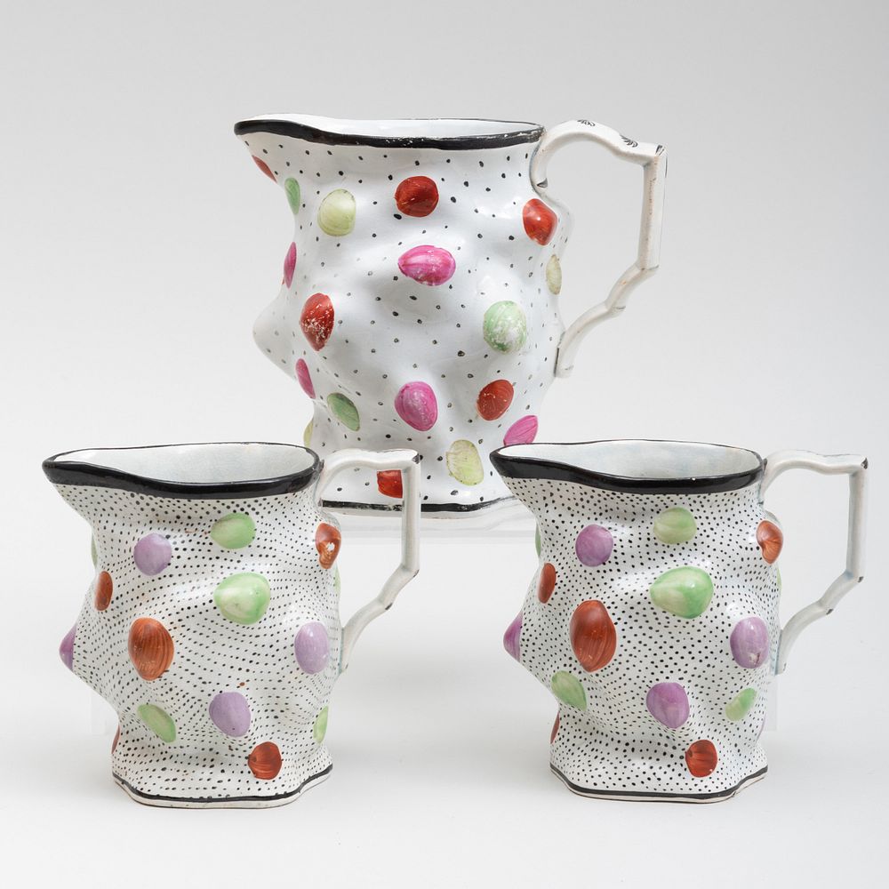 Appraisal: Three English Pearlware Jugs Decorated with Gems The smaller in