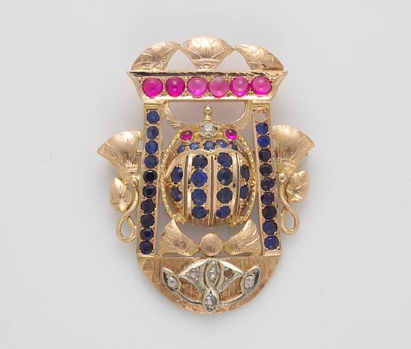 Appraisal: An Egyptian style synthetic sapphire and synthetic ruby brooch-pendant mounted