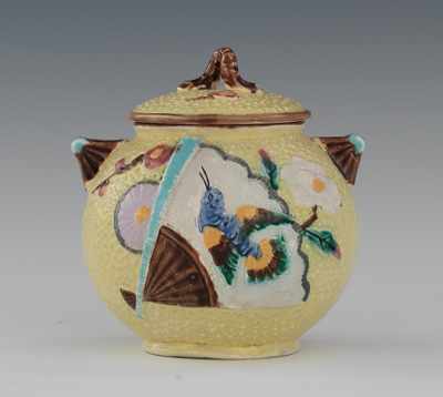 Appraisal: An English Majolica Sugar Bowl with Lid Molded in the