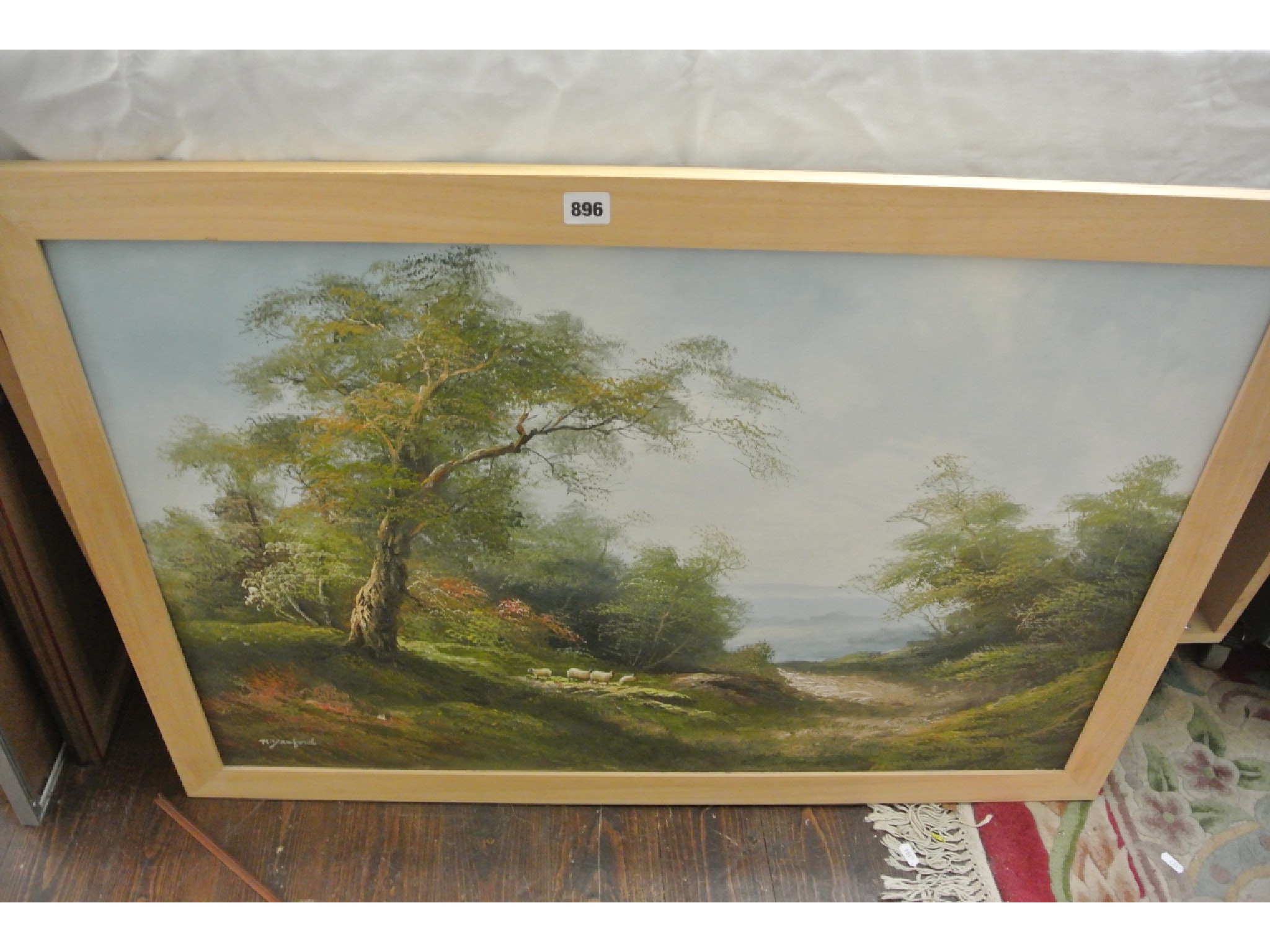 Appraisal: An oil painting on canvas of a country landscape with