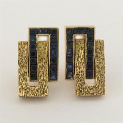 Appraisal: A pair of architectural sapphire and gold earrings of two