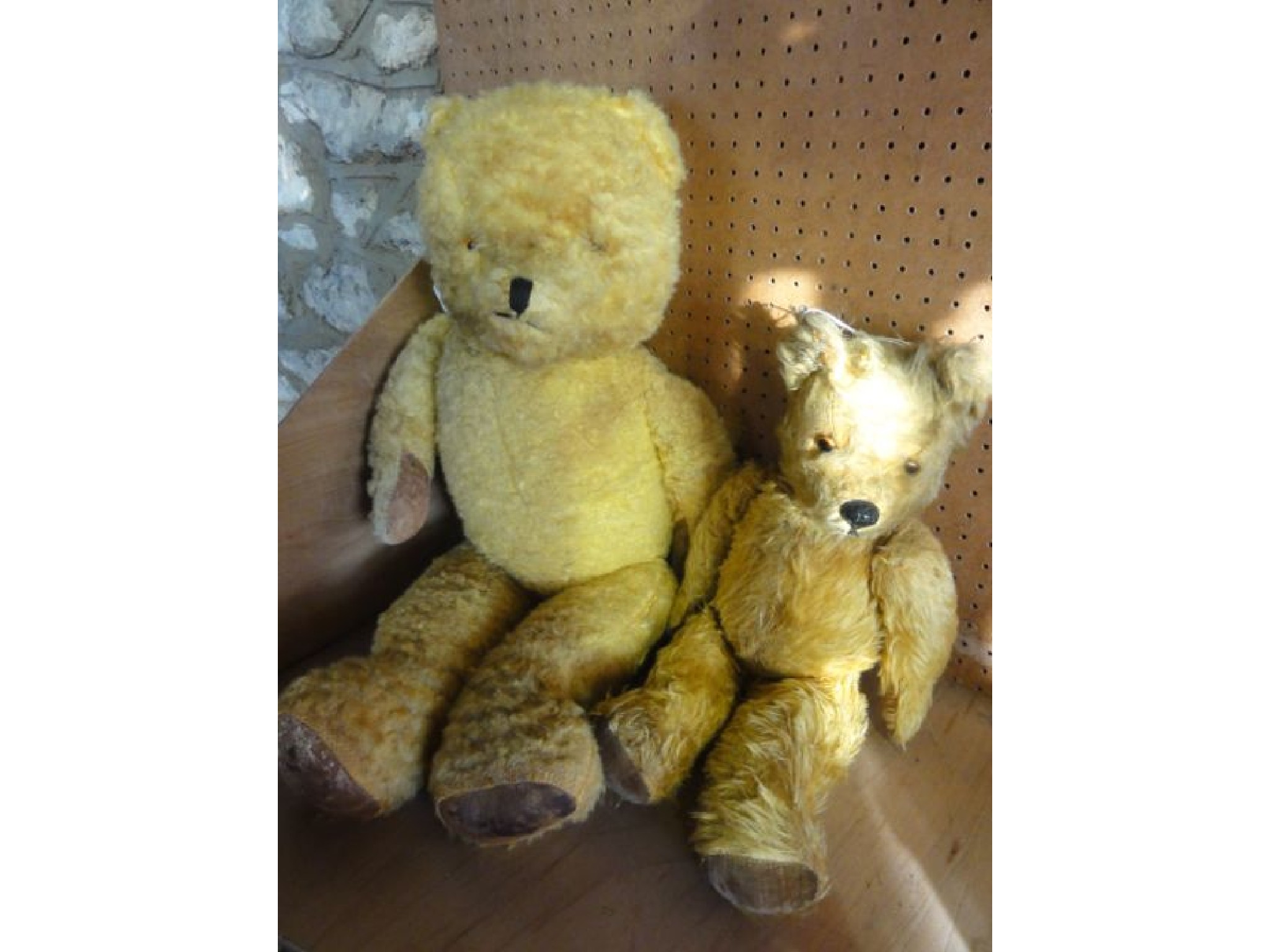 Appraisal: Two vintage teddy bears with inset glass eyes and padded