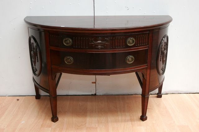 Appraisal: A th century George III style mahogany demilune sideboard in