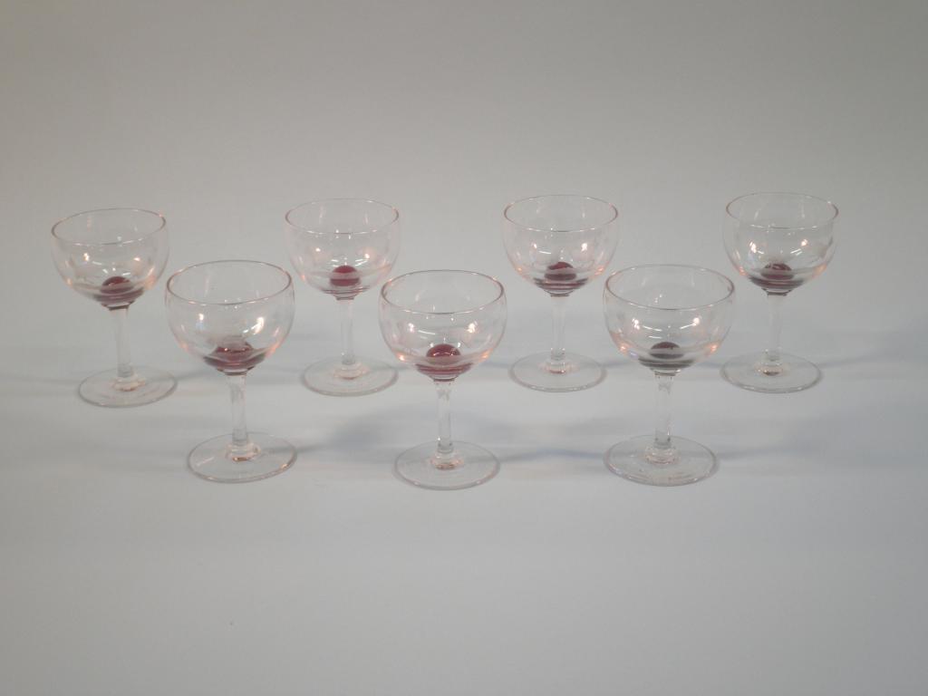 Appraisal: A set of seven thC wine glasses each with a