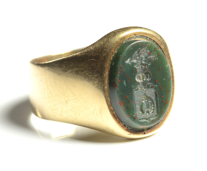 Appraisal: BLOODSTONE AND FOURTEEN KARAT GOLD RING featuring an oval carved