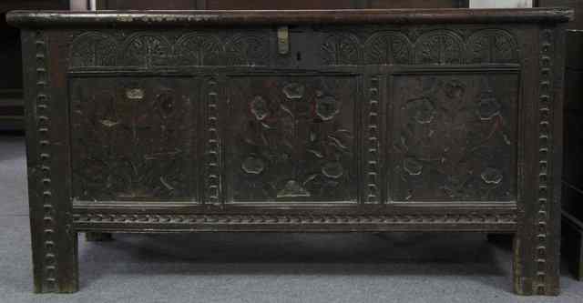 Appraisal: An early th Century oak chest with twin planked hinged