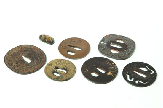 Appraisal: SEVEN SWORD FITTINGS Japan probably th century Six tsuba one