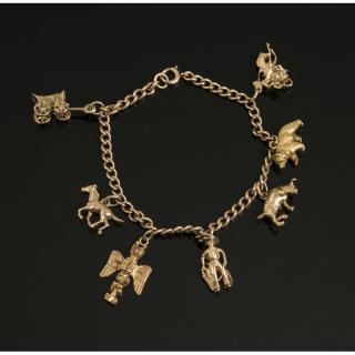 Appraisal: Gold Bracelet with Seven Western Themed Charms Western theme k