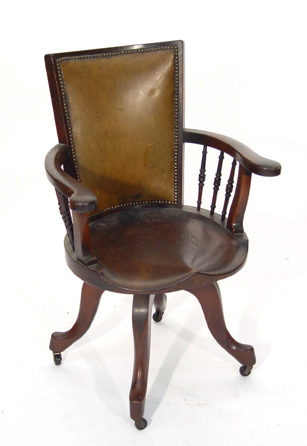 Appraisal: Edwardian mahogany office chair with leather back the arms supported