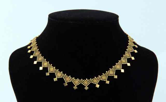 Appraisal: An ct gold fringe necklace the clasp marked cm long