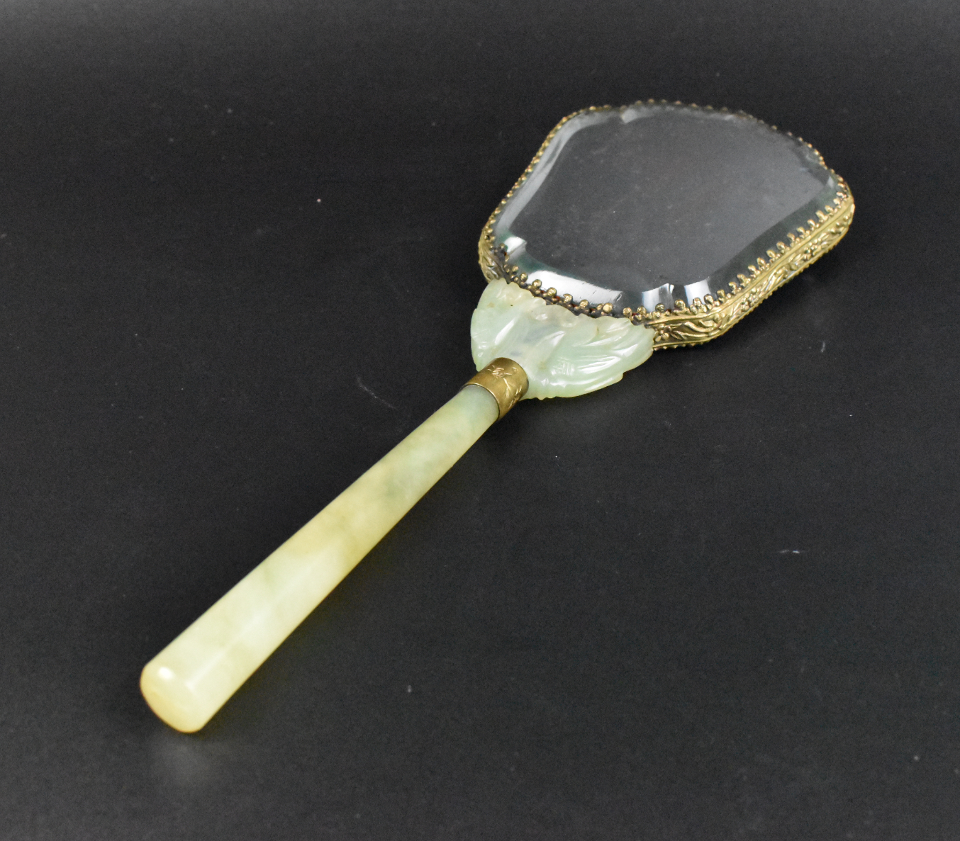 Appraisal: A Chinese jade handheld mirror dated to late Qing Dynasty