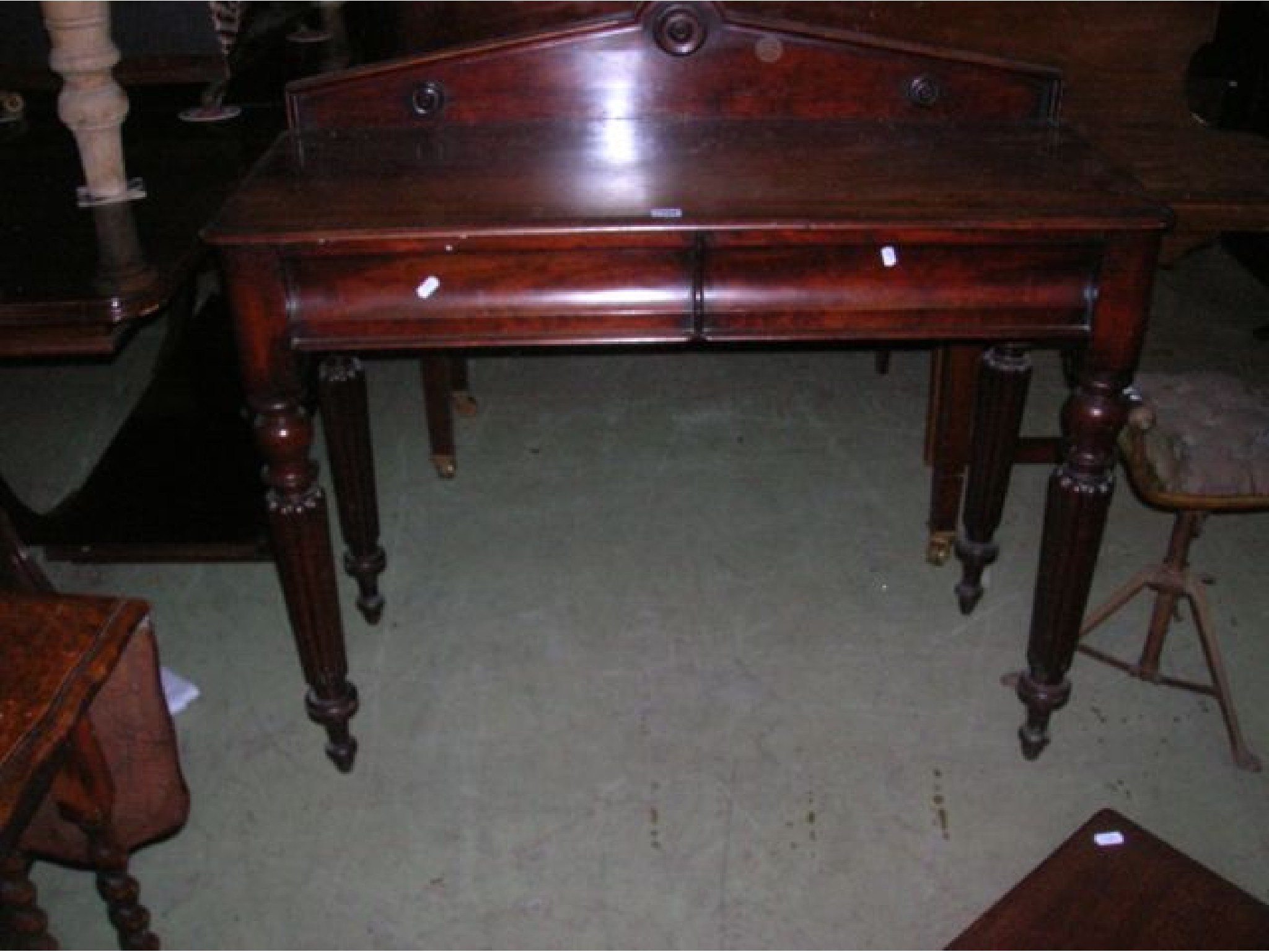 Appraisal: A Victorian mahogany hall table with shallow raised architectural back