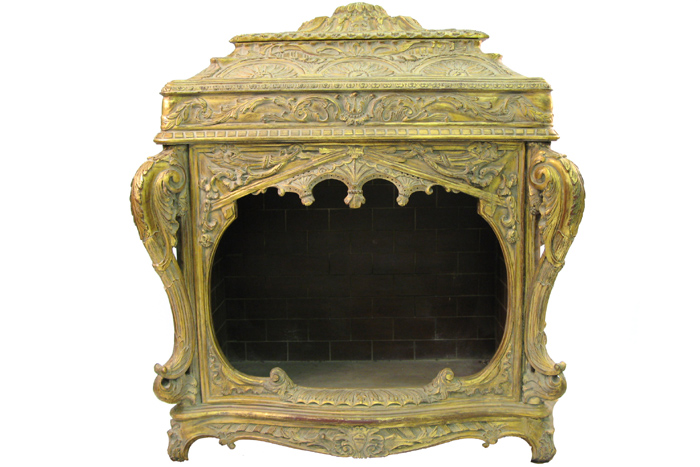 Appraisal: A CONTINENTAL ROCOCO GILTWOOD FIREPLACE the stepped leaf and chandelle