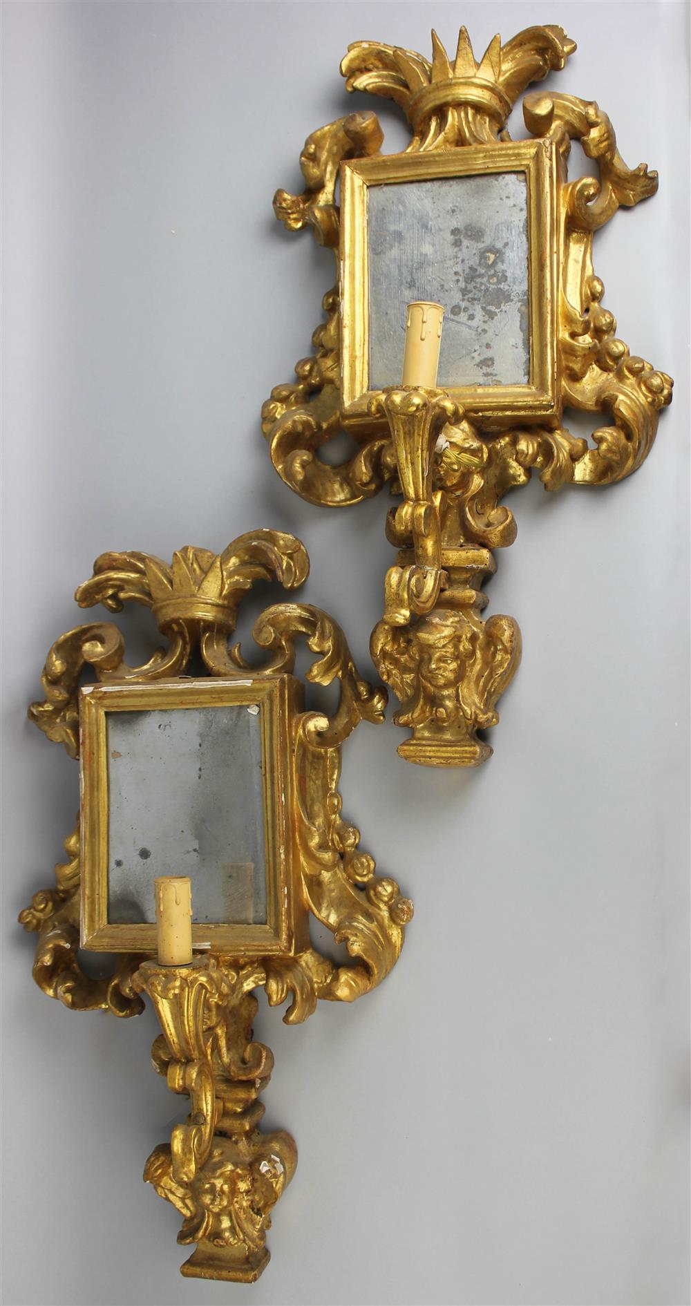 Appraisal: PAIR OF CONTINENTAL GILTWOOD WALL LIGHTS with rectangular mirrored backplate