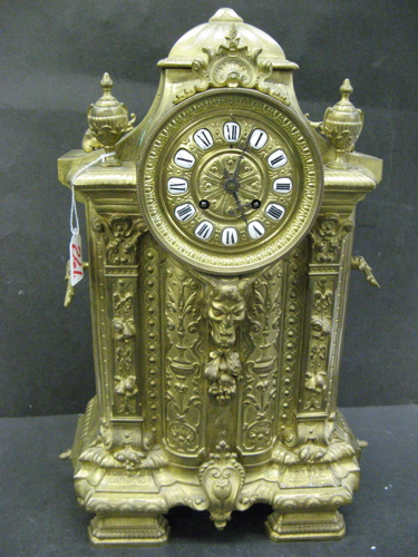 Appraisal: A FRENCH BRASS CASED SHELF CLOCK having porcelainized Roman Numeral