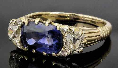 Appraisal: A gold coloured metal mounted sapphire and diamond dress ring