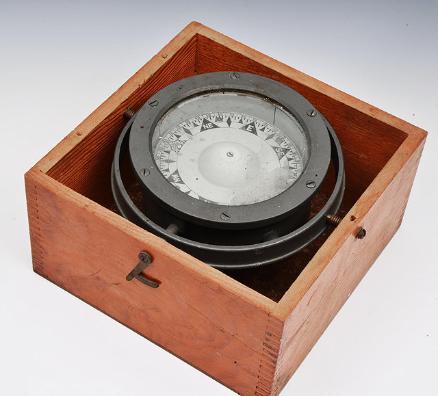 Appraisal: AN OLD SHIPS COMPASS mounted in a grey painted gimbal