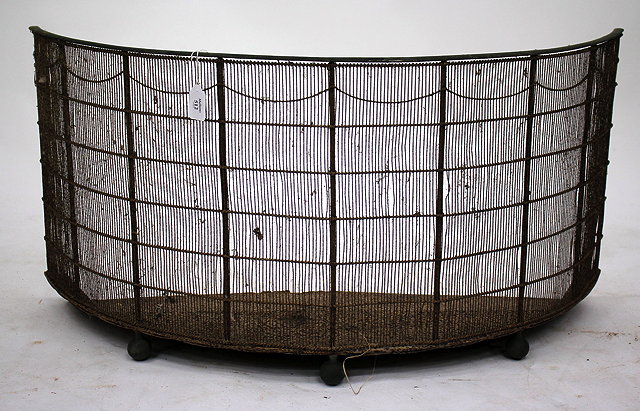 Appraisal: A VICTORIAN DEMILUNE BRASS AND WIRE MESH FIRE GUARD with