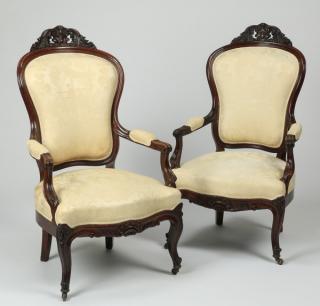 Appraisal: Carved mahogany Victorian armchairs Pair of Victorian carved mahogany armchairs