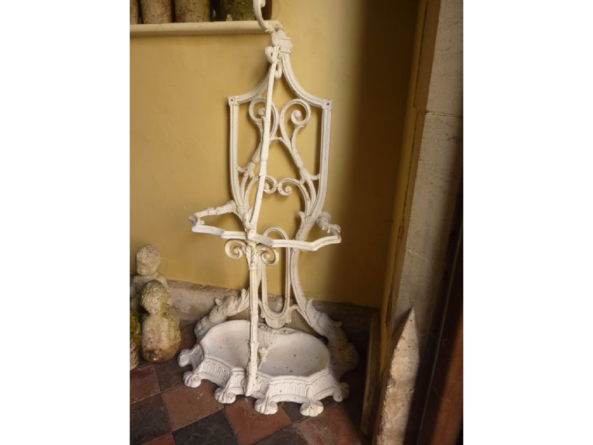 Appraisal: A cast iron hall stand with scrolling acanthus and further