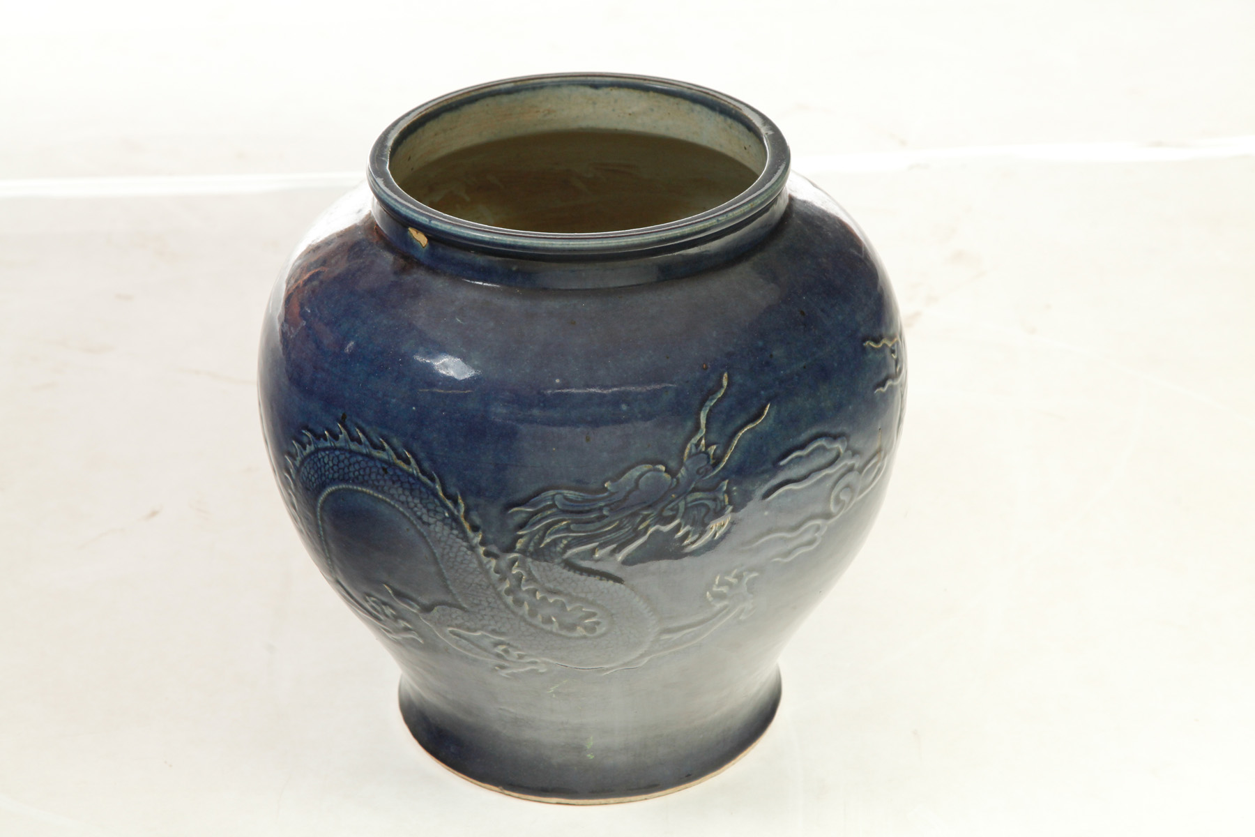 Appraisal: CHINESE JAR WITH DRAGON Twentieth century Cobalt glaze and raised