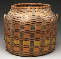 Appraisal: DECORATED HANDLED OPEN TOP BASKET Yellow orange and blue striped