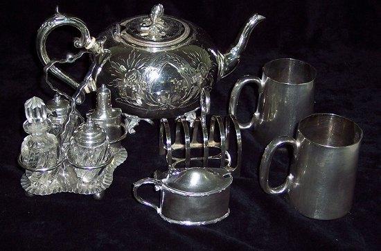 Appraisal: A teapot with bright cut out decoration together with a