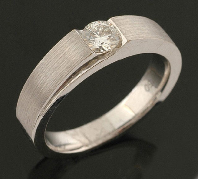 Appraisal: A solitaire diamond ring The round brilliant cut diamond weighing